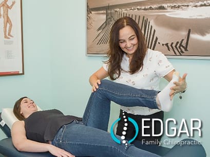 Dr. Maja giving a chiropractic adjustment to a female patient